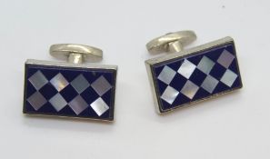 A pair of mother of pearl inlad cufflinks.