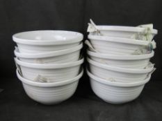Nine matching white mixing bowls (1st lot)