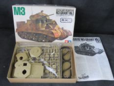 A Tamiya M3 Grant MkI medium tank scale model kit.