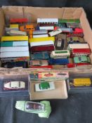 A quantity of assorted scale model vehicles including buses and commercial vehicles.