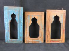 Three contemporart carved wood frames, smallest 28.5cm high, largest 33cm high.