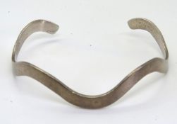 A hallmarked silver bangle.