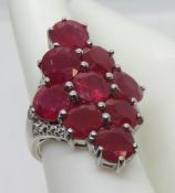 A 925 silver cocktail ring with pink stone cluster, size Q.