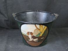 A handpainted ashes bucket with Spaniel design.