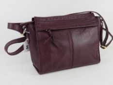 A plum coloured leather handbag by M&S, approx 24cm wide.