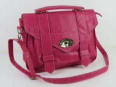 A hot pink satchel type handbag, approx 36cm wide.