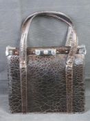 A vintage crocodile leather handbag.