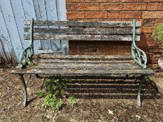 A garden bench having cast iron ends, approx 123cm wide.