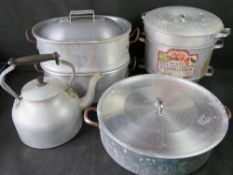 A quantity of steel kitchen pans and a kettle.