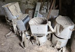 A quantity of apple picking baskets.