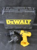 A Dewalt drill and batteries in box.