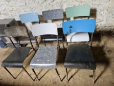Six mid century stacking chairs.