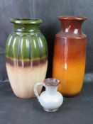 Two large West German pottery vases, together with a West German pottery jug - chip noted to base.