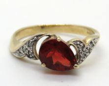A 9ct gold ring having teardrop cut red stone, hallmarked, 2.6g, size N-O.