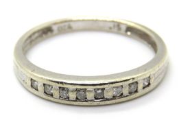 A classic 9ct white gold half eternity ring set with eight diamonds, hallmarked, 2.