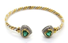An emerald and diamond bangle,