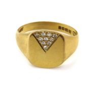 An 18ct gold signet ring having diamond set triangular panel to top, hallmarked for London, size W,