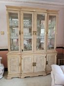 A fine 20th century bleached wood oriental break front display cabinet, illuminated interior with