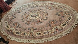 To match lot 34 - A 20th century oriental woollen rug in pink ground with floral pattern