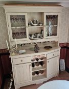 An attractive shaker style dresser, the rack top with twin leaded doors, canted to one side, 144cm