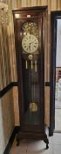 A 20th century three train continental style long case clock by English Elegance.
