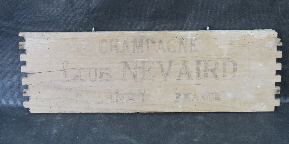A decorative champagne sign made from a vintage transport box,
