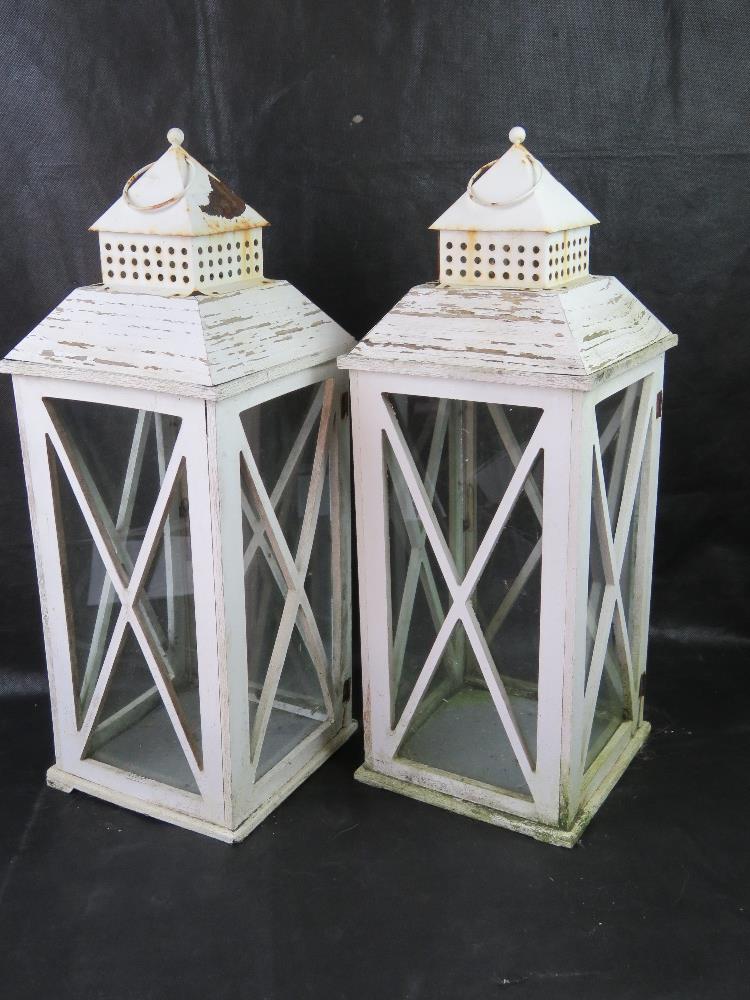 A pair of large glazed lanterns, each standing 60cm high.