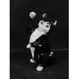 A Just Cats & Co tuxedo cat.