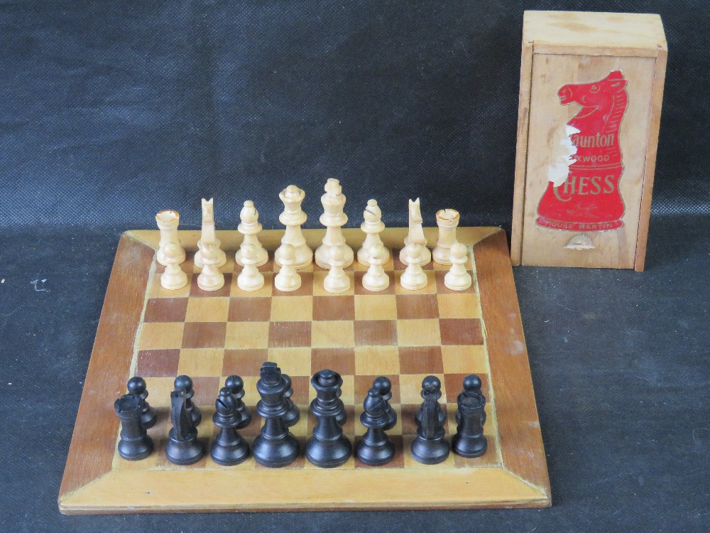 A Staunton box wood chess set with associated board.