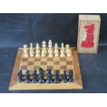 A Staunton box wood chess set with associated board.