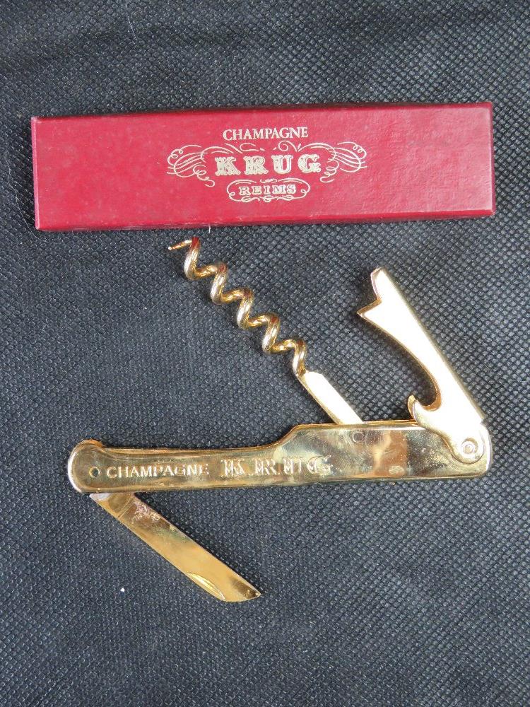 A Krug Champagne bottle opener in original box.