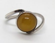 A 925 silver twist style ring with central cabachon, size O.