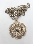 A 935 silver filigree flower pendant on 925 silver chain.