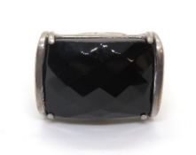 A cocktail ring having large faceted black onyx stone, stamped 925, size P (slightly adjustable.