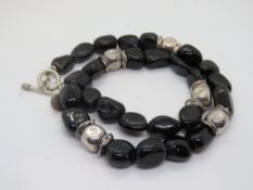 A black onyx and silver necklace by 'Milly' stamped 925.