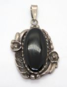 A large silver and black onyx pendant, stamped 925.