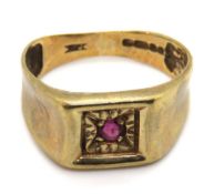 A 9ct gold ring having central starburst set ruby, hallmarked 375, size K-L, 2.4g.