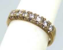 A 9ct gold half eternity ring set with cz stones, hallmarked 375, size K-L,