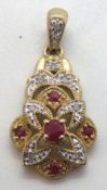 A 9ct gold ruby and diamond pendant approx 26mm in length, hallmarked 375, 2.5g.
