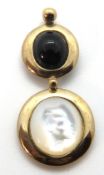 A 9ct gold modernist style pendant having mother of pearl and onyx cabachons upon gold roundels,