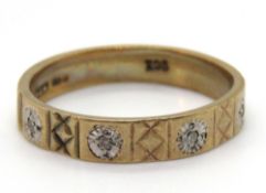 A vintage 9ct gold band having four illusion set diamonds, stamped 9ct, size M, 2.2g.