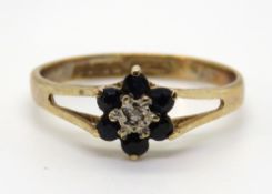 A classic sapphire and diamond floral cluster ring, hallmarked 375, size K-L, 1.