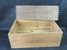 A vintage wine box together with a vintage champagne box sign.
