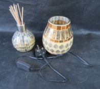 A mosaic glass lamp and incense diffuser