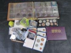 A quantity of half silver coins in folio, and commemorative coins and coin sets.