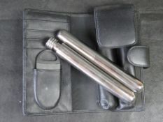 A stainless steel cigar tube and whisky tube set with case and cigar cutter.