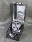 A contemporary watch winder by JQueen.