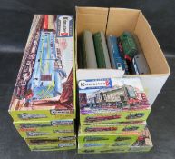 A quantity of Kitmaster scale model railway carriages and locomotive kits.