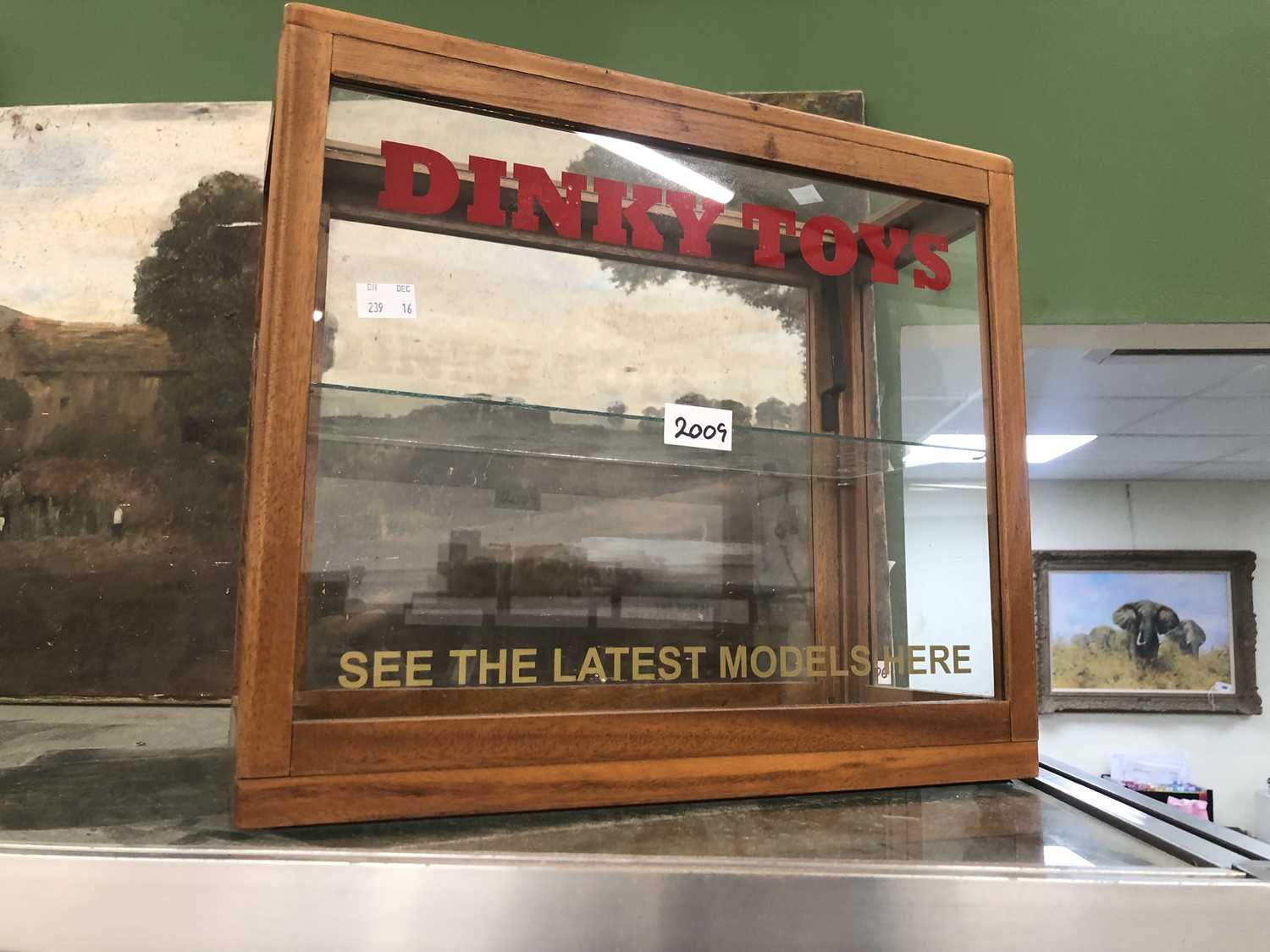 A glazed mahogany Dinky Toys shop display cabinet