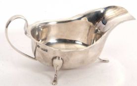 A George V silver sauce boat of typical form, hallmarked for Sheffield 1932, makers mark E Viners
